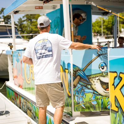 a man doing a trick on a skate board at a skate park