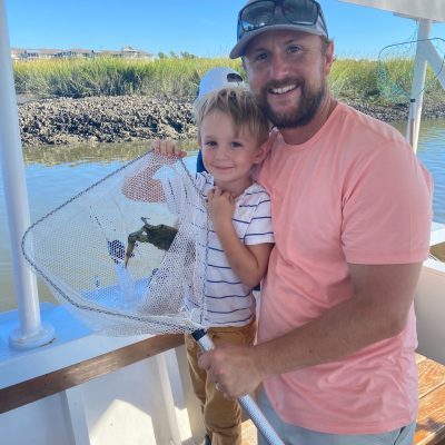 Ron Villone standing in front of a boat