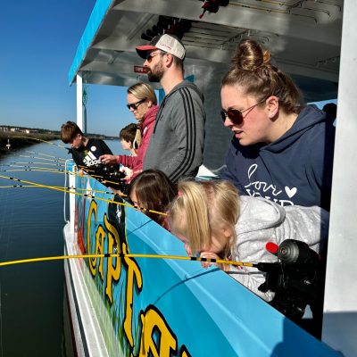 a man sitting on a boat in the water